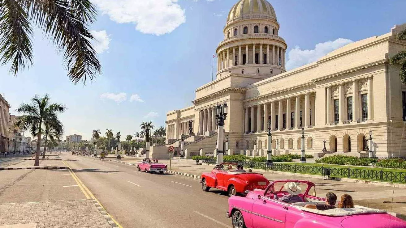 Street of vintage cars in front of El Capitolio in Havana, Cuba